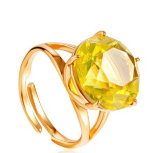 An elegant gold-plated ring with faceted lemon-colored amber "Baccarat