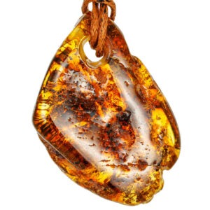 A uniquely shaped pendant made from solid natural amber
