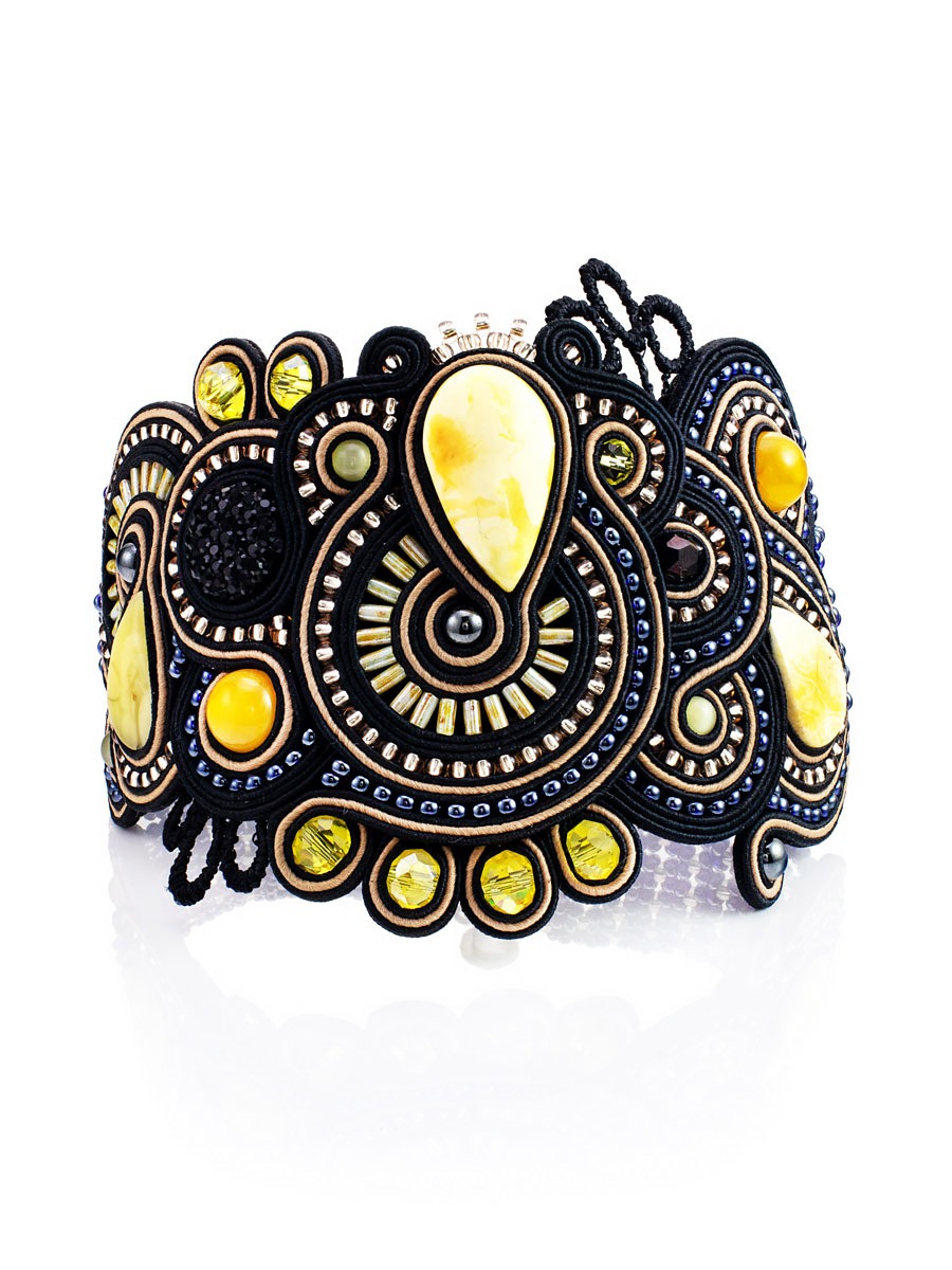 Luxurious braided bracelet with inserts of natural honey amber "India" in black