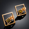 Gold-plated-earrings-Gravity-1.jpeg Emerald Glow Amber Earrings